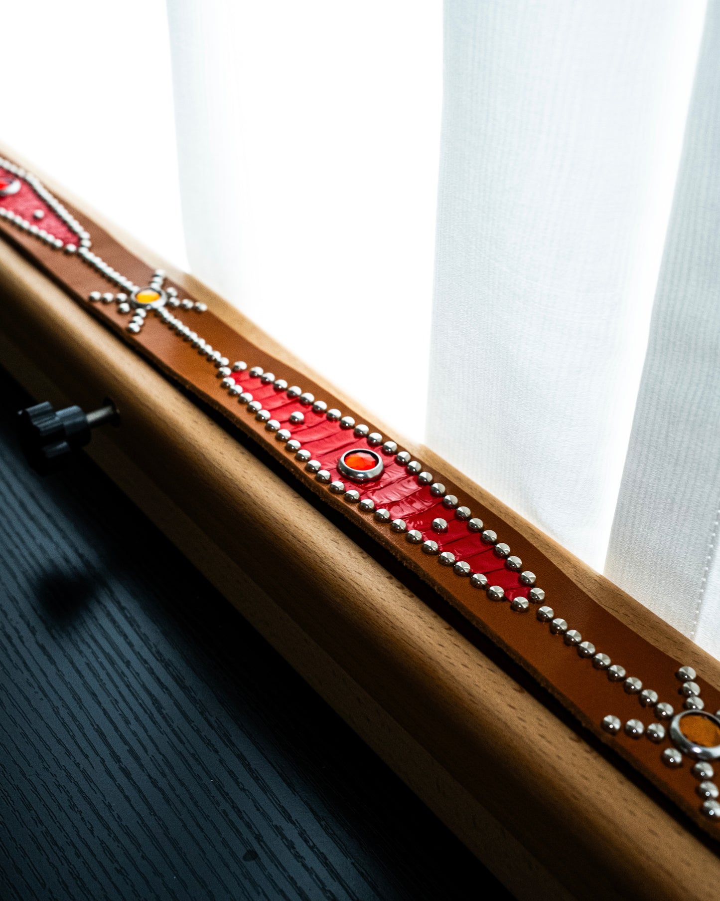 STUDDED RED SNAKESKIN BELT IN ORANGE 01